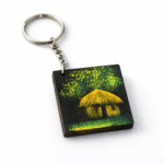 village hut night wooden keychain